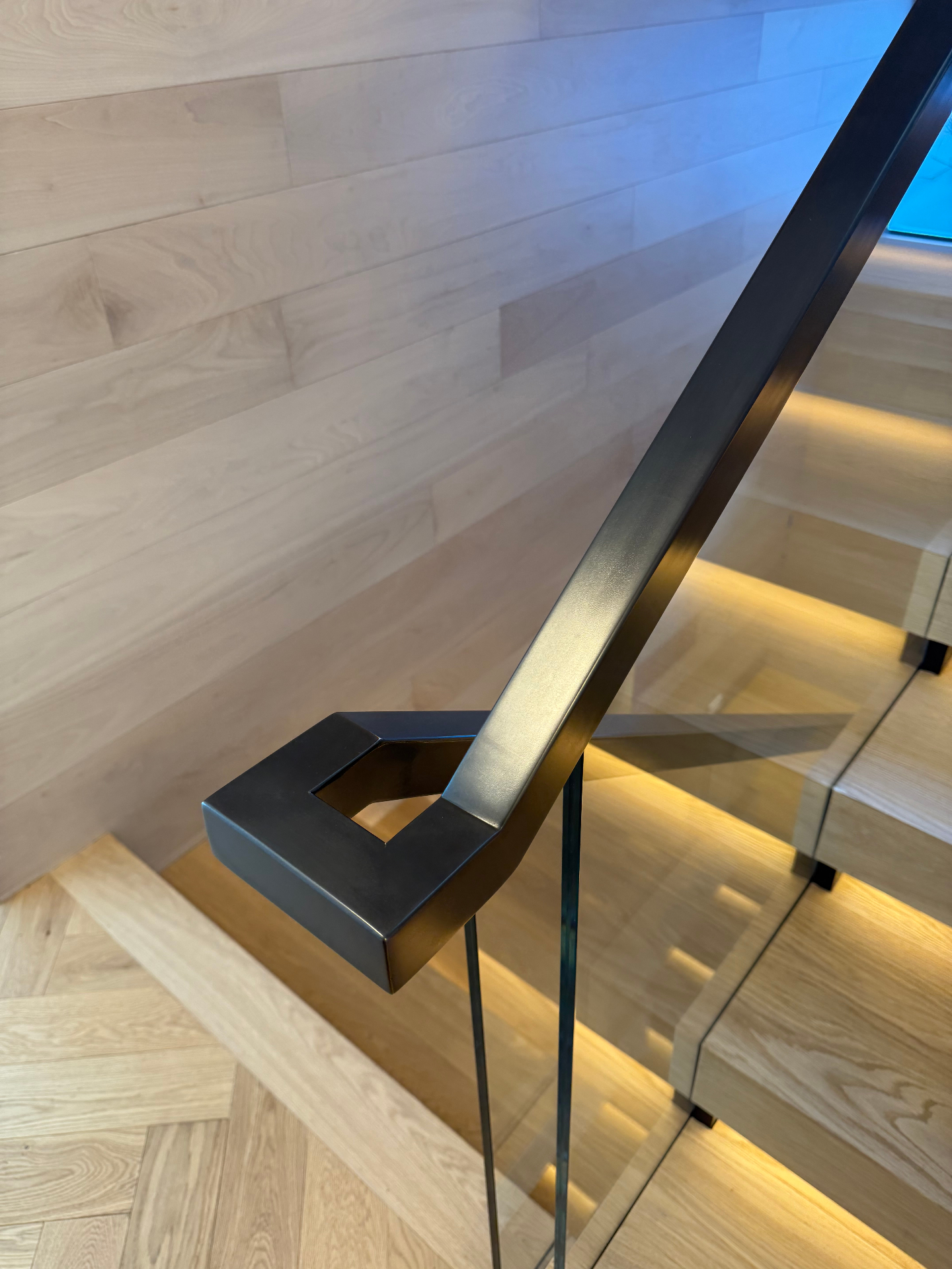 Blackened steel handrail terminal detail